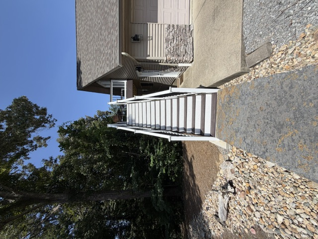 The exterior staircase leading to the loft entrance