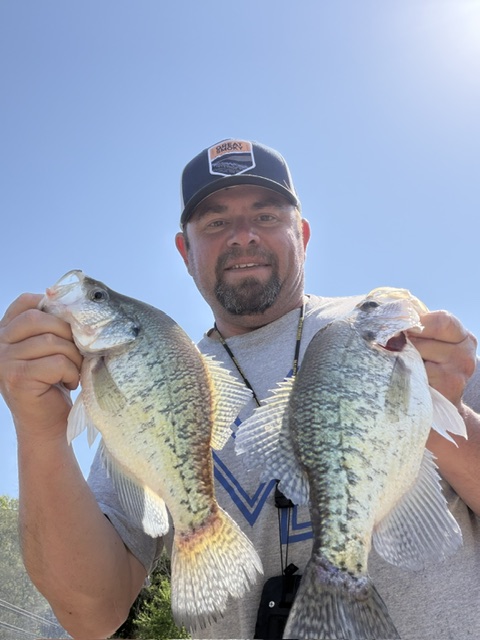 Mike holding two freshly caught crappie